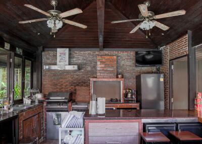 Rustic kitchen with modern appliances and wooden interiors