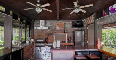 Rustic kitchen with modern appliances and wooden interiors