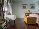 Cozy bedroom with wooden flooring, a chair by the window, bookshelf, and a bed