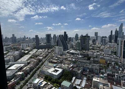 Aerial view of cityscape with modern buildings and clear sky