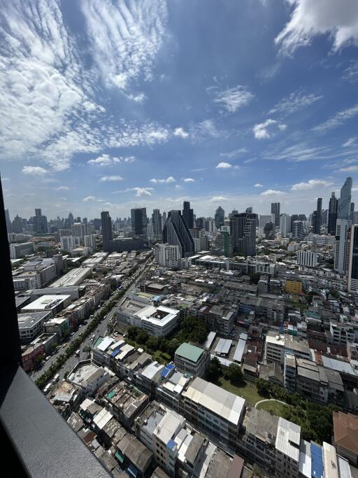 Aerial view of cityscape with modern buildings and clear sky