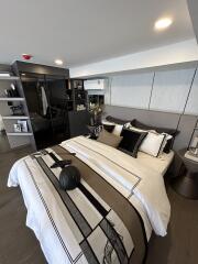 Modern bedroom with bed, bedside tables, and built-in storage