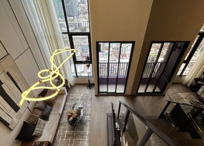 Living room with large windows and city view