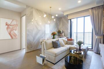 Modern, well-lit living room with a large window and contemporary decor