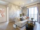 Modern living room with a cozy sofa, coffee table, abstract wall art, and large windows letting in natural light