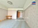 Unfurnished living room with tiled floor, wallpapered walls, and a wooden table