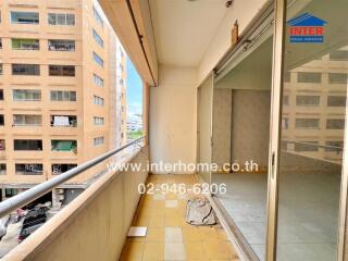 Balcony view with tiled floor and glass door