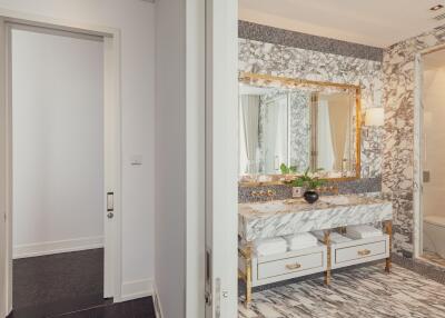 Luxury bathroom with marble countertops and gold accents