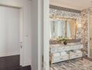 Luxury bathroom with marble countertops and gold accents