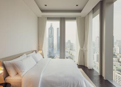 Modern bedroom with city view and natural light