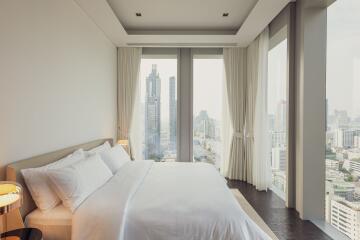 Modern bedroom with city view and natural light