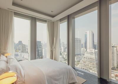 High-rise bedroom with panoramic city view