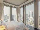 High-rise bedroom with panoramic city view