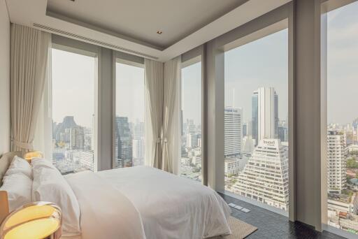 High-rise bedroom with panoramic city view