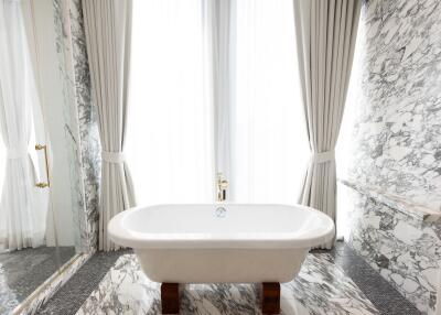 Luxurious marble bathroom with freestanding bathtub