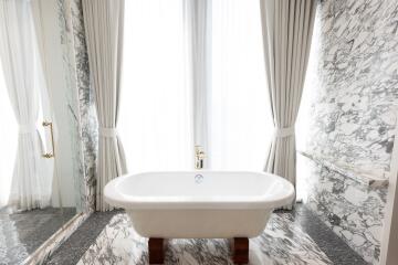 Luxurious marble bathroom with freestanding bathtub