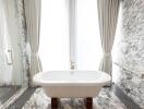 Luxurious marble bathroom with freestanding bathtub