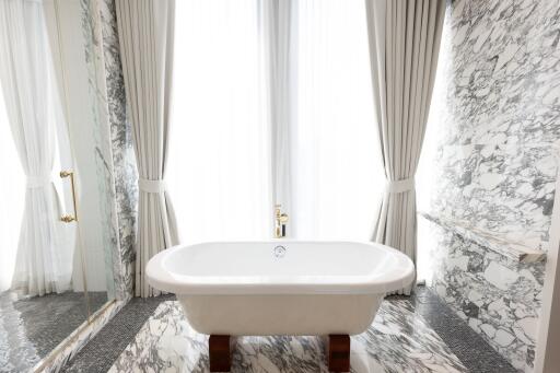 Luxurious marble bathroom with freestanding bathtub