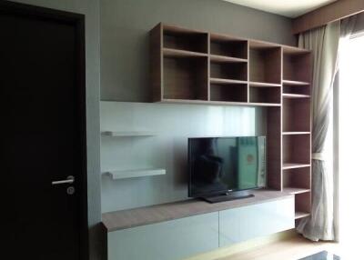 Modern living room with a TV unit and shelves