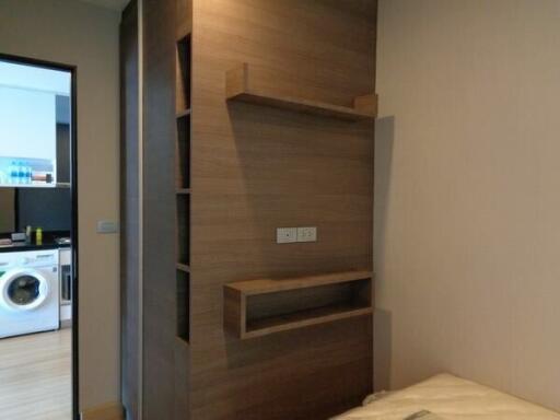 Bedroom with view into the laundry area