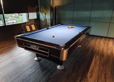 Photo of a recreation room with a pool table