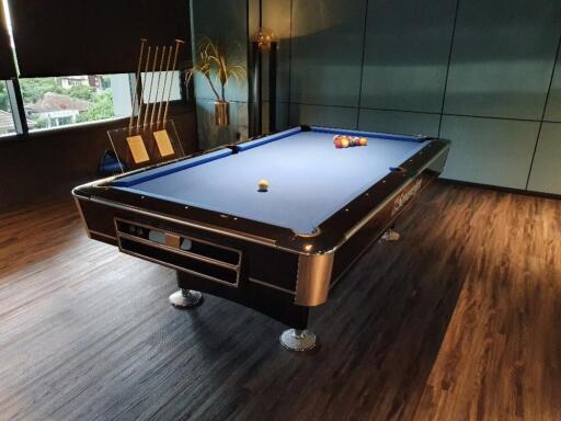 Photo of a recreation room with a pool table