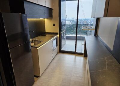 Modern kitchen with appliances and city view from balcony