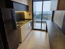 Modern kitchen with appliances and city view from balcony