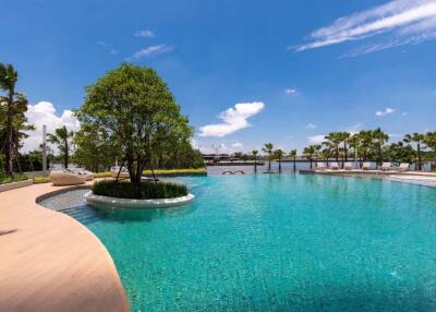 Luxurious outdoor pool area with waterfront views