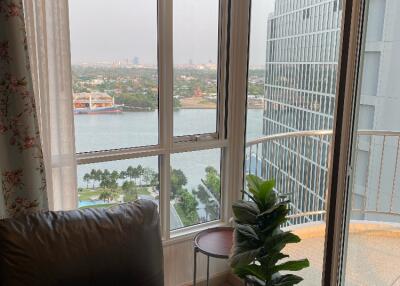 Living room with river view through large windows