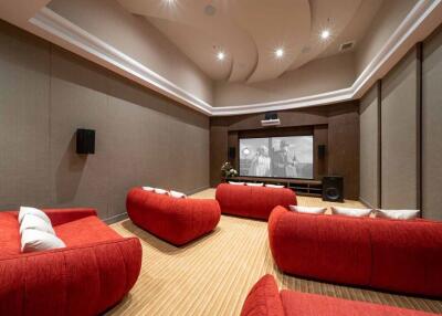 Home Theater Room with Modern Red Seating and Large Screen