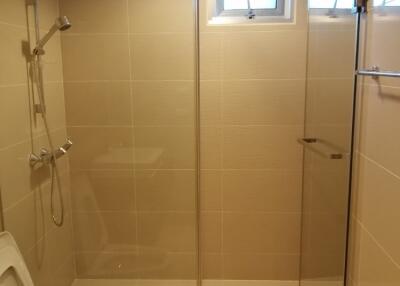 Clean and modern bathroom with glass shower enclosure