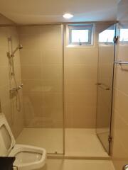 Clean and modern bathroom with glass shower enclosure