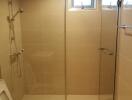 Clean and modern bathroom with glass shower enclosure