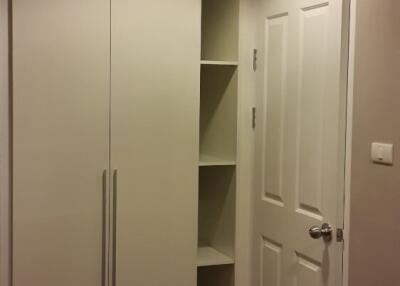 Bedroom with built-in closet and shelving