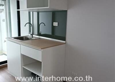 Modern kitchen with sink and cabinetry