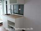 Modern kitchen with sink and cabinetry