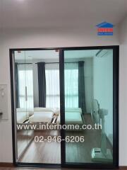 Bedroom with glass sliding doors and double bed