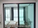 Bedroom with glass sliding doors and double bed