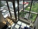 Living room with large windows and a view of the outdoors