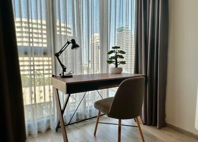 Cozy home office with a view of city buildings