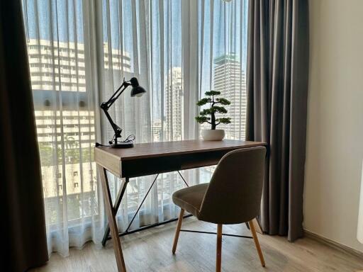 Cozy home office with a view of city buildings