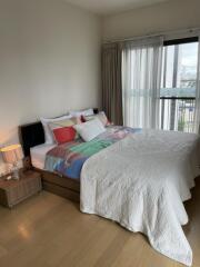 Well-lit bedroom with modern decor