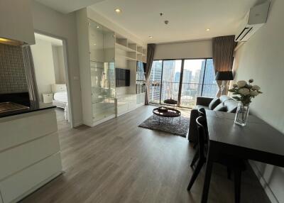 Modern living room with balcony view and dining area