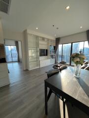 Spacious living room with large windows and modern decor