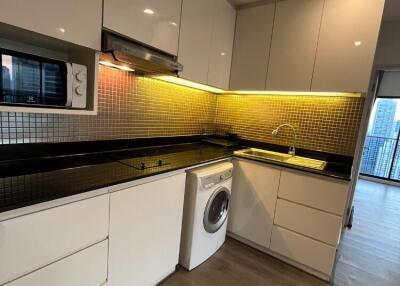 Modern kitchen with appliances and under-cabinet lighting