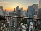 High-rise balcony with panoramic city view at sunset