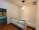 Hallway with modern light fixtures and wooden flooring