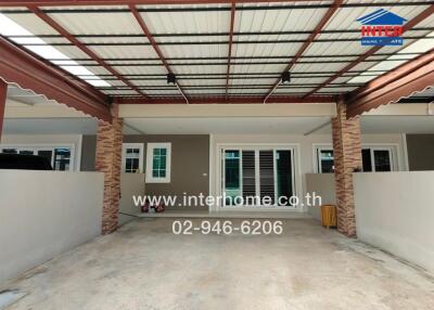 Covered carport area with parking space