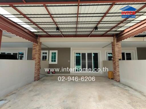 Covered carport area with parking space